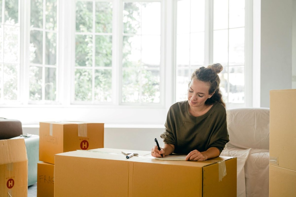 A woman organizing her belongings for a move